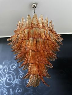 an orange chandelier hanging from the ceiling