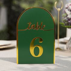 Quantity: 1-25 Table Number Cards Material: Cardstock Paper & Foil Color: Hunter Emerald Green | Metallic Gold Style: Arch Cutout Tent Card Overall Size: 5"w X 7"h Card Thickness: 300 Gsm Features: High Quality Thick Cardstock Paper, Double Sided, Sturdy, Durable Note: Listing Is For Table Number Cards Only. Other Decorations Are Not Included Additional Information: Listing Is For Wedding Table Number Cards Only. Stands And Other Additional Decorations Are Not Included. Uses: Weddings, Restauran Emerald And Gold Centerpieces, Emerald And Gold Quince Theme, Emerald And Gold Party, Green And Gold Party Theme, Green And Gold Centerpieces, Emerald Green And Gold Wedding Decor, Dark Emerald Green Wedding, Green Arch Wedding, Emerald Quince