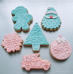 decorated cookies are arranged on a table