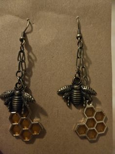 In honor of our "Honey Man" Grandfather, who recently passed on, these bee-themed earrings celebrate his memory. Bottles contain his real, raw honey. Honey Bee Earrings, Hood River, Earrings Antique, Bee Earrings, Bee Theme, Raw Honey, Antique Earrings, Antique Brass, Jewelry Earrings Dangle