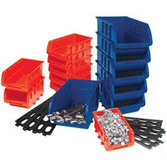 plastic storage bins with various types of screws and nuts in them on a white background