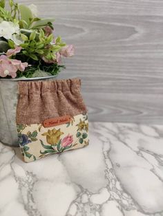 a potted plant sitting on top of a marble counter