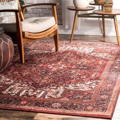 a red rug with an ornate design on it