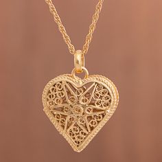 Exquisite filigree openwork forms a star motif on this elegant and luxurious locket. Designed by Peruvian artisan Giuliana Valz-Gen, the heart-shaped locket is crafted from sterling silver with a plating of 21 karat gold. Star Motif, Filigree Jewelry, Filigree Earrings, Sterling Silver Filigree, Silver Filigree, Locket Necklace, Jewelry Gift Box, Gold Plated Sterling Silver, Free Jewelry