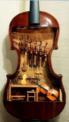 an old violin with many instruments in it