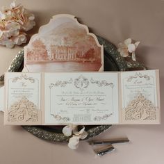 the wedding stationery is laid out on a plate