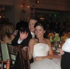 a group of people sitting at a dinner table