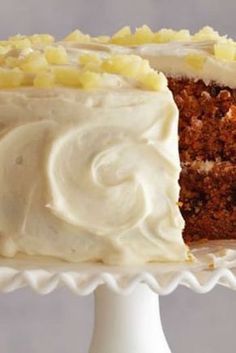 a cake with white frosting is on a plate