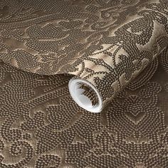 a close up view of a wallpaper with an intricate design on the fabric,