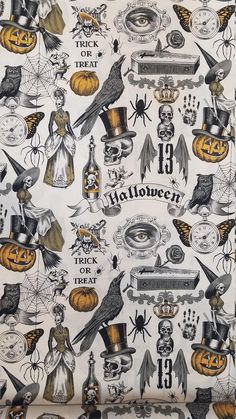 halloween themed fabric with pumpkins, witches and other items on white background by the yard