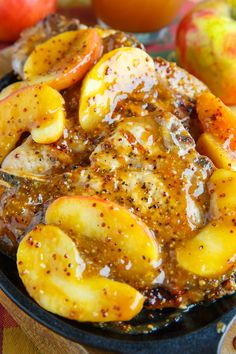 a close up of food on a plate with apples