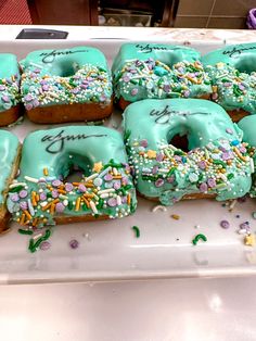 there are many doughnuts with frosting and sprinkles on them