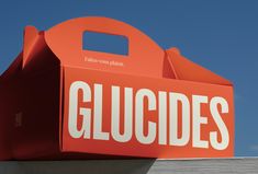 an orange box with the word gluddles written on it