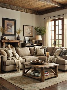 a living room filled with furniture and a fire place next to a wooden coffee table