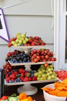 an assortment of fruits and vegetables displayed on a table