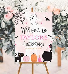 welcome to taylor's first birthday sign with black cats and pumpkins on it