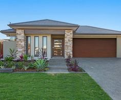 a house with landscaping in front of it