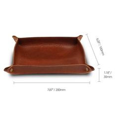 the leather tray is shown with measurements