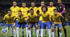 a group of soccer players pose for a team photo