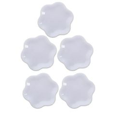 four white plates on a white background