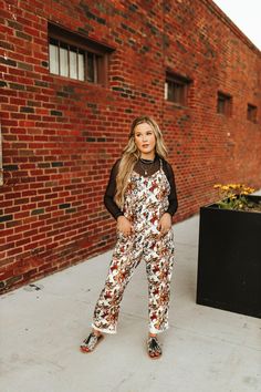 Hit the trail in style with our Buckaroo Jumpsuit! This comfy one-piece features a playful horses and cowboys graphic, perfect for adding a touch of Western charm to your wardrobe. Whether you're exploring the great outdoors or just lounging around, this jumpsuit is ready for adventure. Printed Jumpsuits And Rompers For Fall, Casual Printed Jumpsuits And Rompers For Fall, Trendy Brown Jumpsuits And Rompers For Spring, Casual Fall Overalls For Outdoor, Casual Fall Outdoor Overalls, Trendy Brown Jumpsuits For Spring, Trendy Jumpsuits And Rompers For Fall Day Out, Western Winter, Corduroy Jumpsuit