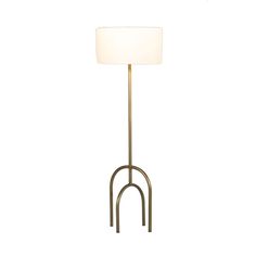 a floor lamp with a white shade on it's base and an iron frame