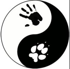 a black and white yin sign with paw prints