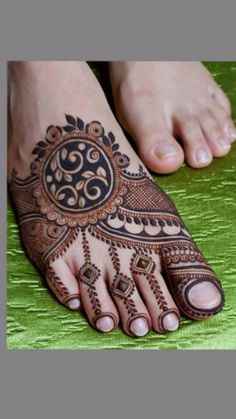 the feet are decorated with henna designs