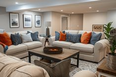 a living room filled with furniture and pillows on top of it's couches