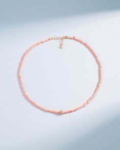 A delicate necklace featuring vibrant round pink coral beads paired with an 18-karat gold mini rondelle charm. This piece perfectly captures the essence of summer with its bright, refreshing hues and elegant design. The adjustable length ensures a comfortable fit, making it an ideal accessory for any summer outfit. Det Knotted Necklace, Pink Jewelry, Pink Coral, Bead Stringing, Coral Beads, Knot Necklace, Silk Thread, Rose Gold Necklace, Delicate Necklace