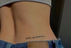 a woman's lower back tattoo with the words all the rage broke home written on it