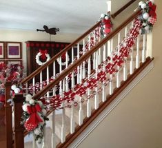 christmas decorations on the banisters of a house