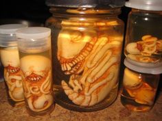 several jars filled with food sitting on top of a table