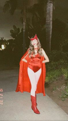 a woman in a red cape and white tights