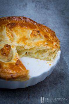 there is a pie that has been cut in half on the plate and ready to be eaten