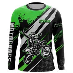 a green and black shirt with a dirt bike rider on it's back,