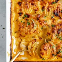 a casserole dish filled with chicken and cheese