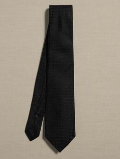 The perfect finishing touch, this tie is made from soft and smooth silk.  Measures 3" at widest point.  Length: 58" (147cm) Max width: 3" Fitted Standard Tie For Business, Semi-formal Tailored Suit And Tie Accessories, Tailored Suit And Standard Tie Accessories For Semi-formal Occasions, Dapper Ties For Business Casual, Dapper Fitted Ties For Business Casual, Fitted Dapper Ties For Business Casual, Classic Black Ties For Business, Classic Fitted Ties For Formal Occasions, Classic Neckwear For Black Tie Events