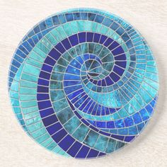 a blue and green mosaic tile design coaster