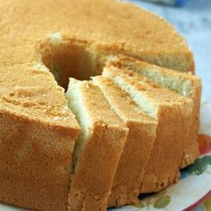 a cake that has been cut into slices on a plate with the rest of the cake missing