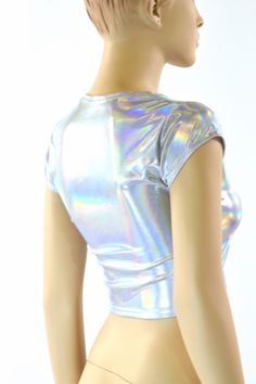 "This item is made to order, please read all the way through the listing before purchasing! This shiny, liquidy holographic top has a smooth reflective finish that bends the light in beautiful shifting rainbows. It features a scoop neckline and cute little cap sleeves. Four way stretch spandex for a great fit! TOP LENGTH: Underarm to hemline measures 8\" Womens Sizing (See below for instructions on where measurements should be taken) XXS: Bust 29\"-30\" / Waist 22\"-23\" / Hips 30\"-32\" Extra S Fitted Iridescent Tops, Metallic Shiny Fitted Tops, Fitted Metallic Shiny Tops, Fitted Metallic Tops For Festival, Fitted Silver Top For Festivals, Holographic Crop Top, Holographic Top, Festival Outfit Inspiration, Olive Branch