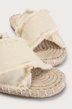 Get ready to explore your vacay destination in style in the Lulus Verka Beige Denim Espadrille Slide Sandals! Sturdy, frayed beige denim shapes a crisscrossing peep-toe upper, atop a jute-wrapped espadrille insole. Faux leather pad at heel adds some extra cushioning for maximum comfort all day long! Easy, slide-on design. 0. 25" rubber heel. Cushioned insole. Rubber sole has nonskid markings. Man made materials. Imported. Lulus | Verka Beige Denim Espadrille Slide Sandal Heels | Size 10. Beige Summer Espadrilles For Vacation, Cotton Sandals For Spring Vacation, Cotton Sandals For Vacation In Spring, Spring Vacation Cotton Sandals, Summer Beige Espadrilles, Beige Summer Espadrilles, Cream Summer Espadrilles For Beach, Trendy Beige Espadrilles For Vacation, Trendy Beige Espadrilles For Summer