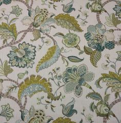 an upholstered fabric with flowers and leaves on it