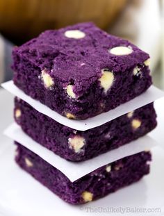 three purple brownies stacked on top of each other