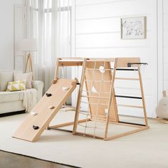 a child's play area with a slide and climbing frame