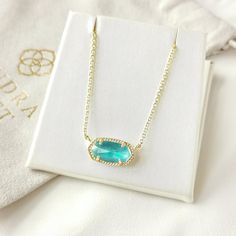 Kendra Scott Dust Bag Included 14k Gold Plated Over Brass Aqua Kyocera Opal 0.63"L X 0.38"W Stationary Pendant, 15" Chain With 2" Extender A Dainty Stone And Delicate Metallic Chain Combine To Create The Elisa Pendant Necklace In Aqua Kyocera Opal, Your New Favorite Wear-Anywhere Accessory. This Pendant Necklace Can Be Paired With Any Look, Providing That Extra Touch Of Timeless Style. Make The Elisa Pendant Necklace A Staple In Your Wardrobe And You Will Not Be Disappointed. Opal Pendant Necklace, Birthday List, Kendra Scott Jewelry, Clothes Ideas, Opal Pendants, Kendra Scott