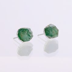 A raw emerald earring stud set with a petite textured bezel. These rough emeralds are tumble polished, and complemented with a textured setting around the edges of the raw gemstone.  This earring stacks well with other earrings with multiple piercings. These ear studs have been dipped in real 24k gold. -5-10mm Genuine Raw Emeralds -Pure Sterling Silver post and back The earring post and back are made entirely with pure sterling silver. Unlike other electroforming artists, I use silver and 14k go Earring Stud Set, Earring Stacks, Earrings Silver Studs, Raw Crystal Earrings, Emerald Earring, Raw Emerald, Multiple Rings, Multiple Piercings, Emerald Earrings Studs