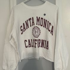 New With The Sticker On It! Cropped Style. Super Cute. Size Medium. Smoke Free Home! White Crew Neck Crop Top With Letter Print, White Long Sleeve Crop Top With Graphic Print, White Cotton Crop Top For Fall, White Tops For College In Fall, Hollister Sweatshirt, Sherpa Lined Hoodie, Hollister Hoodie, Hollister Sweater, Collared Sweatshirt