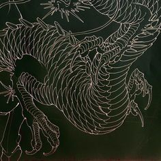 a drawing of a dragon on a blackboard