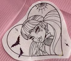 a heart shaped sticker with a drawing of a girl on it